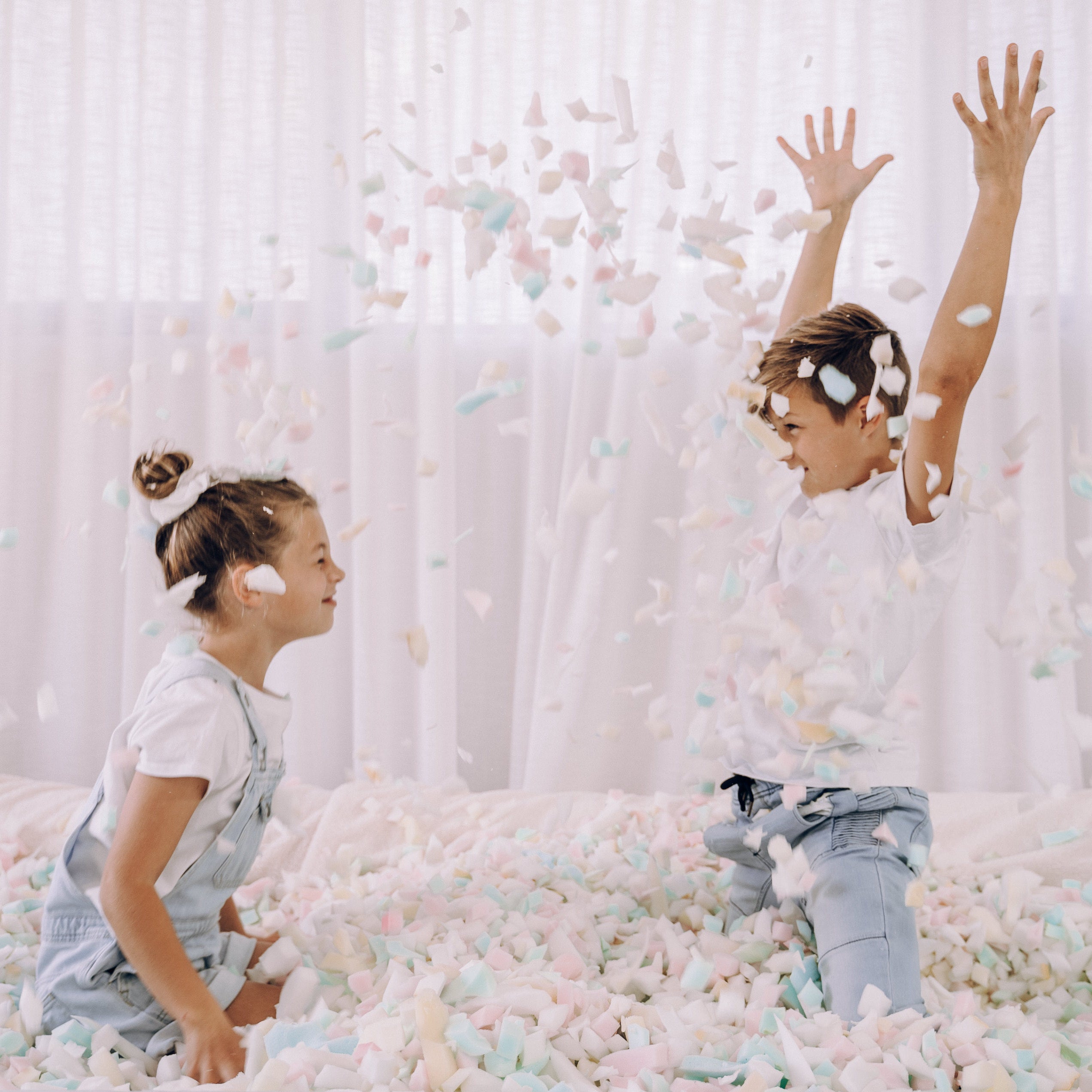 Kids throwing foam in foam pit
